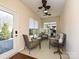 Inviting sunroom with multiple seating options, natural light, and views of the landscaped yard at 8024 Carolina Lakes Way, Fort Mill, SC 29707