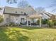 Large backyard with patio, gazebo, and lush landscaping at 813 Garbow Ct, Charlotte, NC 28270