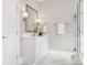 Clean bathroom with white vanity, marble flooring, and a shower at 813 Garbow Ct, Charlotte, NC 28270