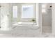 Luxurious bathroom with marble finishes, soaking tub and a glass shower at 813 Garbow Ct, Charlotte, NC 28270