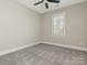 Simple bedroom with neutral walls, carpet flooring, and a window with blinds at 813 Garbow Ct, Charlotte, NC 28270