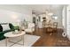 Open concept dining area with kitchen view and stylish light fixture at 813 Garbow Ct, Charlotte, NC 28270