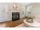 Modern fireplace with dark stone surround and white mantel at 813 Garbow Ct, Charlotte, NC 28270