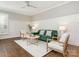 Relaxing living room with green velvet sofa and wood accent chairs at 813 Garbow Ct, Charlotte, NC 28270