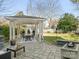 Outdoor patio area with a gazebo, seating, and fire pit at 813 Garbow Ct, Charlotte, NC 28270