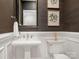 Elegant powder room with dark wallpaper and pedestal sink at 813 Garbow Ct, Charlotte, NC 28270