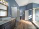 Bathroom with dark wood cabinets, granite countertop, and tile flooring at 8440 Mossy Cup Trl, Harrisburg, NC 28075