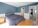 Bright bedroom with hardwood floors and neutral decor at 8440 Mossy Cup Trl, Harrisburg, NC 28075