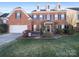 Brick house with a two-car garage and manicured lawn at 8440 Mossy Cup Trl, Harrisburg, NC 28075