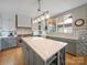 Updated kitchen featuring white and gray cabinets at 8440 Mossy Cup Trl, Harrisburg, NC 28075