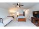 Bedroom with two twin beds, TV stand and ceiling fan at 9009 Powder Works Dr, Huntersville, NC 28078