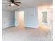 Spacious bonus room with carpet, ceiling fan and multiple entrances at 9009 Powder Works Dr, Huntersville, NC 28078