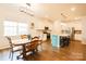 Charming dining area with wooden table and chairs, adjacent to kitchen at 9009 Powder Works Dr, Huntersville, NC 28078