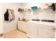 Laundry room with washer, dryer, and ample storage shelves at 9009 Powder Works Dr, Huntersville, NC 28078