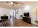 Spacious living room features a fireplace, ceiling fan, and hardwood-style flooring at 9009 Powder Works Dr, Huntersville, NC 28078