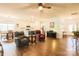 Open-concept living room flows into a modern kitchen, featuring hardwood floors and recessed lighting at 9009 Powder Works Dr, Huntersville, NC 28078