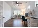 Bright home office space with a ceiling fan, a large window, and wood floors at 9009 Powder Works Dr, Huntersville, NC 28078