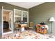 An enclosed porch featuring windows and a door leading to the home's interior at 9009 Powder Works Dr, Huntersville, NC 28078