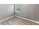 Small bedroom with gray walls and wood-look floors at 9022 Belle Bragg Way, Charlotte, NC 28214