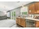 Kitchen with sink, dishwasher, and view into living room at 9022 Belle Bragg Way, Charlotte, NC 28214