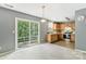 Kitchen with wooden cabinets, stainless steel appliances, and sliding door at 9022 Belle Bragg Way, Charlotte, NC 28214