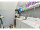 Laundry room with washer, dryer, and shelving at 9022 Belle Bragg Way, Charlotte, NC 28214