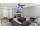 Living room with brown sectional sofa and fireplace at 9022 Belle Bragg Way, Charlotte, NC 28214