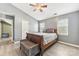 Main bedroom with door to hallway and ceiling fan at 9022 Belle Bragg Way, Charlotte, NC 28214