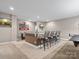 Basement bar with seating and granite countertop at 9117 Monarchos Ct, Waxhaw, NC 28173