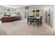 Basement sitting area with leather sofa and dining table at 9117 Monarchos Ct, Waxhaw, NC 28173