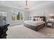 Spacious Primary bedroom with large windows and chandelier at 9117 Monarchos Ct, Waxhaw, NC 28173