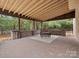 Covered patio with brick flooring and seating area at 9117 Monarchos Ct, Waxhaw, NC 28173