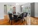 Formal dining room with dark wood table and gray chairs at 9117 Monarchos Ct, Waxhaw, NC 28173