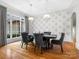 Bright dining room featuring large windows and patterned wallpaper at 9117 Monarchos Ct, Waxhaw, NC 28173