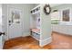 Laundry room with built-in storage, a bench, and a view to backyard at 9117 Monarchos Ct, Waxhaw, NC 28173