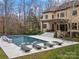 Inviting pool area with lounge chairs and fire pit at 9117 Monarchos Ct, Waxhaw, NC 28173