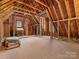 Unfinished attic space with exposed wooden beams at 9117 Monarchos Ct, Waxhaw, NC 28173