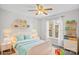 Bright bedroom with a white bed, playful decor, and soft blue accents, creating a cozy and inviting space at 926 Lone Oak Ln, Mooresville, NC 28115