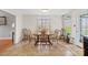 A cozy dining area features a wood table and 6 chairs, and a large window at 926 Lone Oak Ln, Mooresville, NC 28115