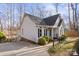 Charming home showcasing white siding, black shutters, and well-manicured landscaping around the property at 926 Lone Oak Ln, Mooresville, NC 28115