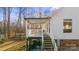 Back exterior of a house showing a covered back deck, stairs, and access to the backyard at 926 Lone Oak Ln, Mooresville, NC 28115