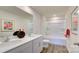 Bathroom with tub, double vanity, and wood-look floors at 1020 20Th Avenue Se Way, Hickory, NC 28602