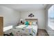 Bright bedroom with dinosaur-themed bedding and ample natural light at 1020 20Th Avenue Se Way, Hickory, NC 28602