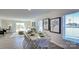 Dining area with hardwood floors and large windows, adjacent to living room at 1020 20Th Avenue Se Way, Hickory, NC 28602