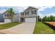 Two-story house with gray siding, stone accents, and a two-car garage at 1020 20Th Avenue Se Way, Hickory, NC 28602