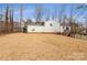 Large backyard with straw ground cover at 10414 Club Car Ct, Mint Hill, NC 28227