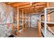 Unfinished basement area with storage shelving at 10414 Club Car Ct, Mint Hill, NC 28227