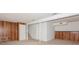 Unfinished basement with wood paneling and ample storage at 10414 Club Car Ct, Mint Hill, NC 28227