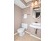 Small bathroom with toilet, sink, and vanity at 10414 Club Car Ct, Mint Hill, NC 28227