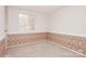 Bright bedroom with patterned wallpaper and neutral carpeting at 10414 Club Car Ct, Mint Hill, NC 28227